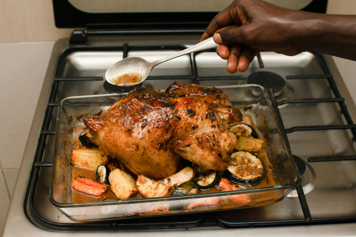 seasoned chicken and vegetables on baking tray