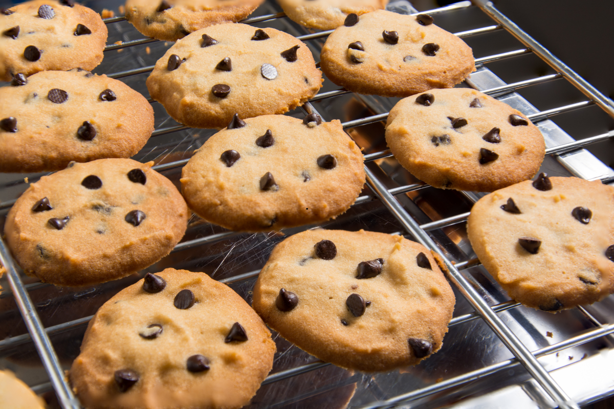 Bakery-style soft and chewy chocolate chip cookies cooling on rack
