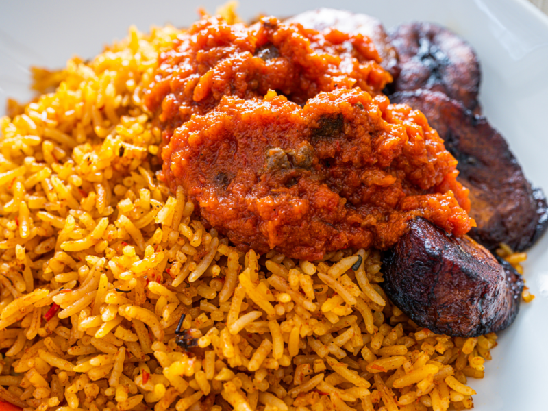Easy Nigerian Jollof Rice Recipe for Beginners served with fried chicken