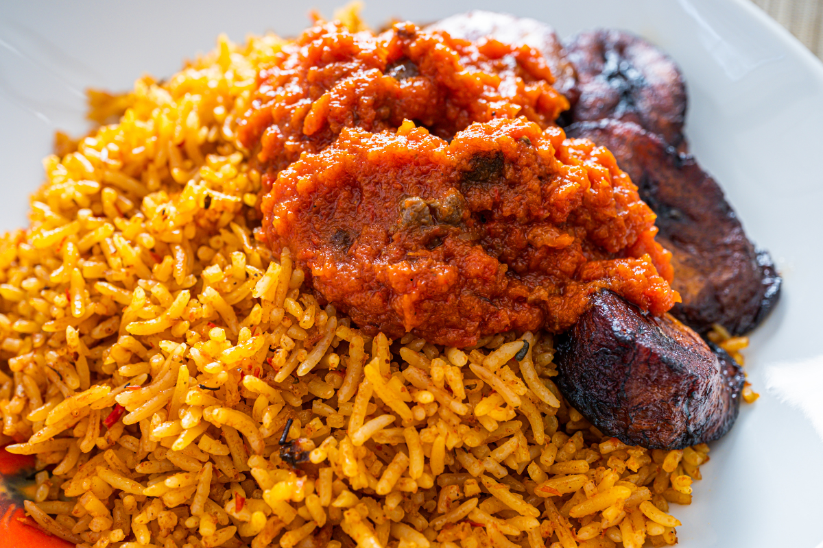 Easy Nigerian Jollof Rice Recipe for Beginners served with fried chicken