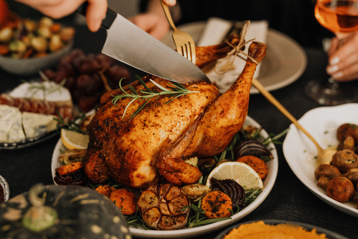 Make-ahead Thanksgiving recipes served on a festive holiday dinner table.