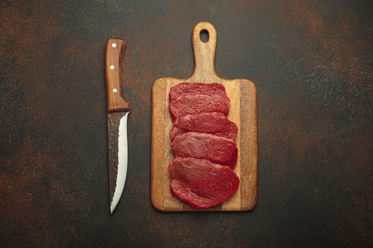 Allowing meat to reach room temperature before cooking