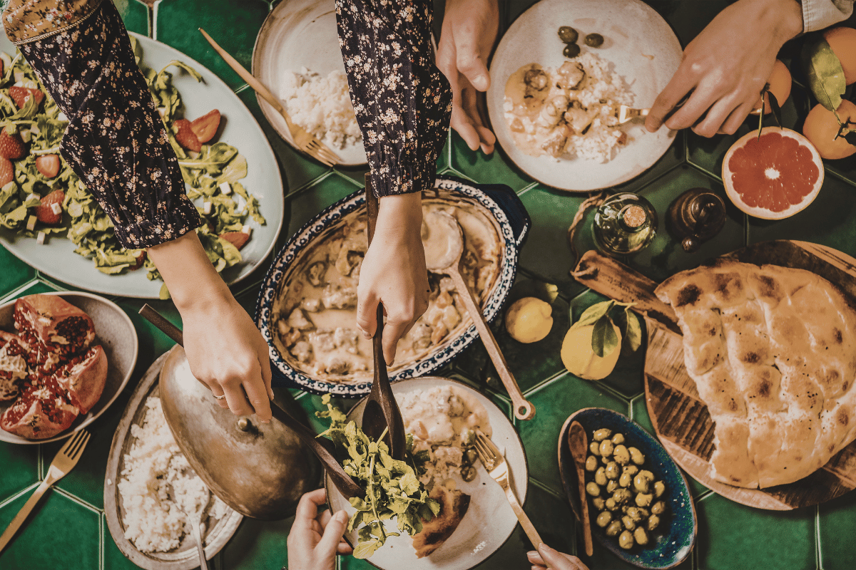 Family enjoying make-ahead Thanksgiving recipes together.