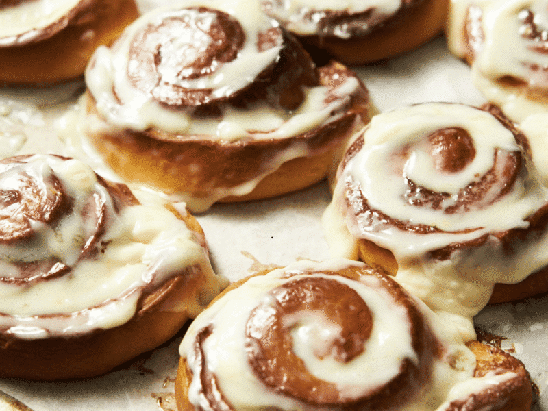 Soft and fluffy cinnamon rolls with cream cheese frosting fresh from the oven