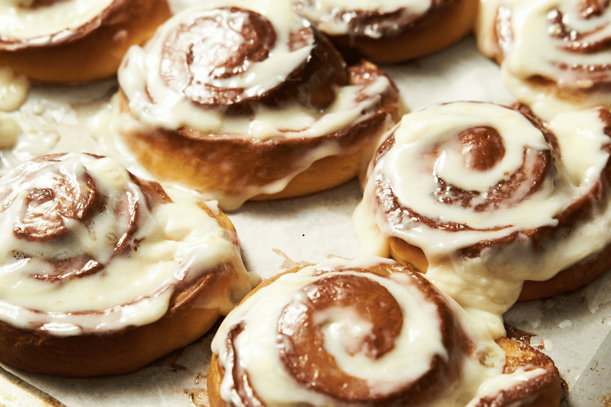 Soft and fluffy cinnamon rolls with cream cheese frosting fresh from the oven