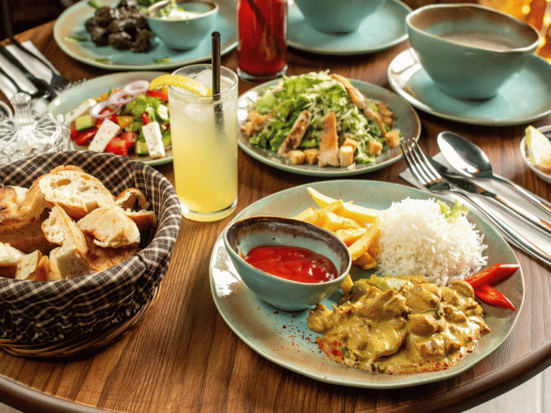 Easy family meals served around a dinner table with chicken, vegetables, and rice