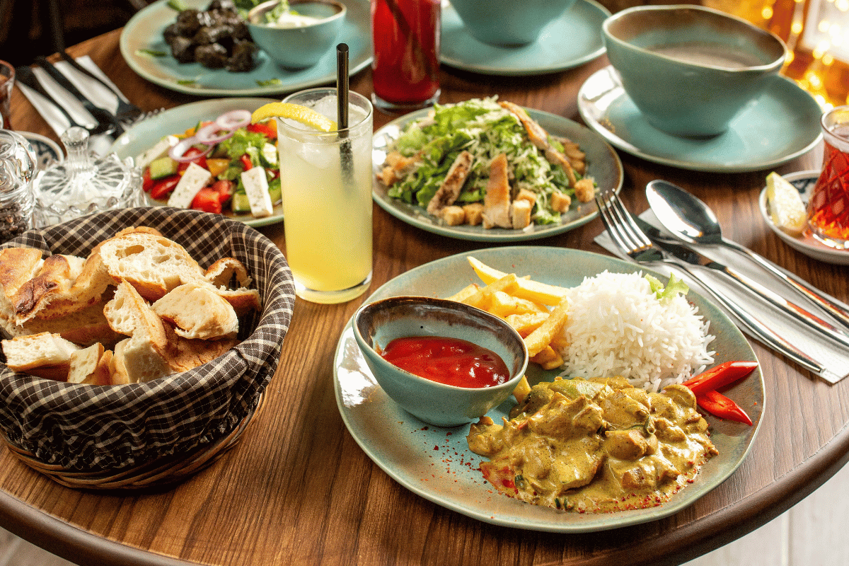 Easy family meals served around a dinner table with chicken, vegetables, and rice