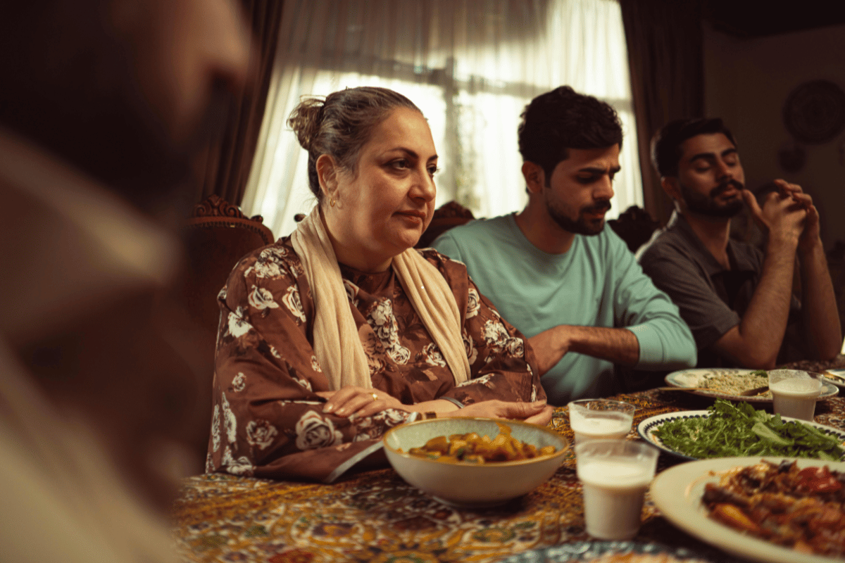 Family gathered around the dinner table enjoying soup