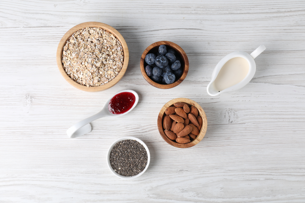 Healthy smoothie ingredients including Greek yogurt berries oats and chia seeds