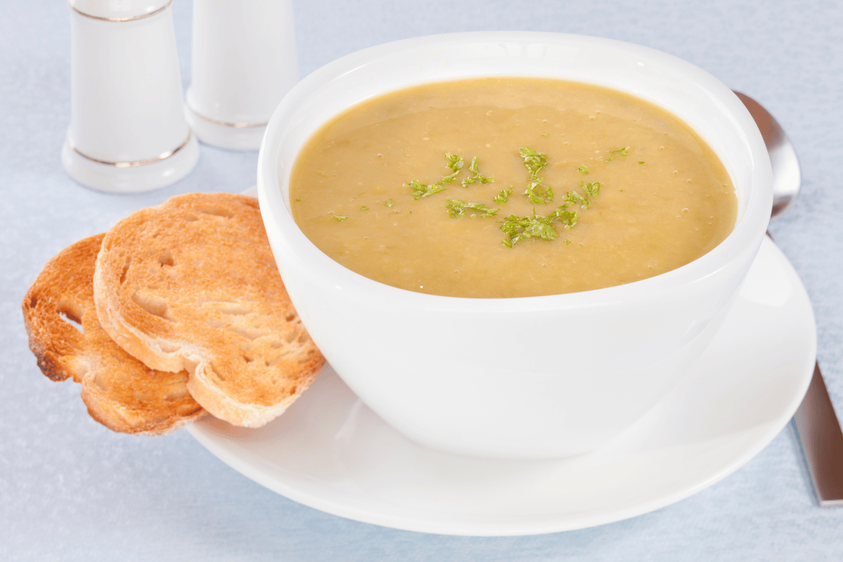 Classic split pea fall soup recipe served with rustic bread