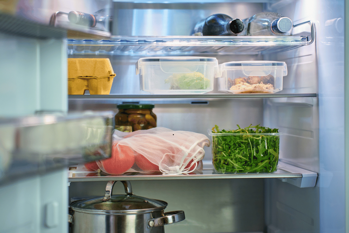 Food stored in clear airtight containers inside a refrigerator