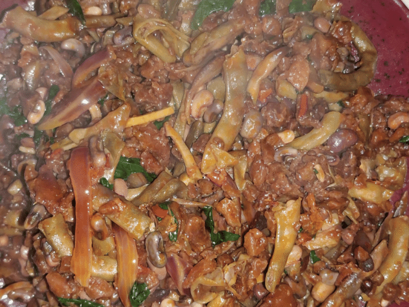 Fresh akidi and achicha recipe served with ukpaka, garden eggs, and palm oi