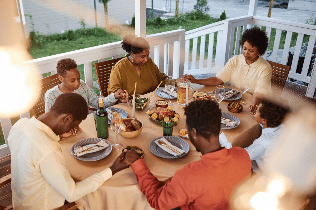 Family preparing a Thanksgiving dinner with delicious side dishes