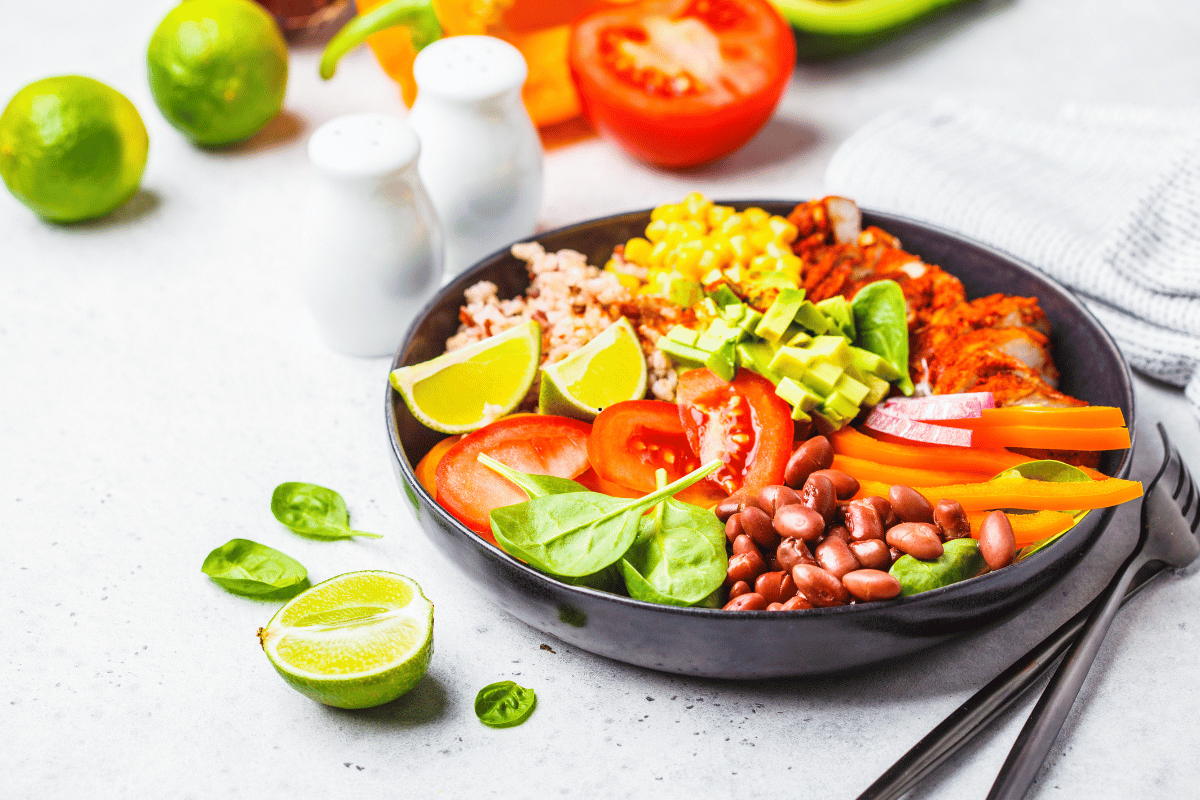 chicken and black bean bowl with brown rice avocado and vegetables