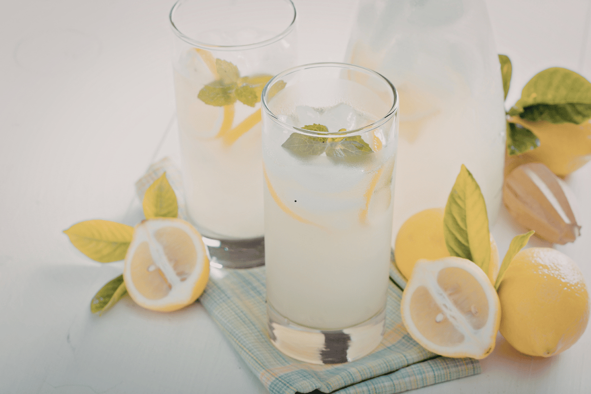 Easy homemade lemonade recipe with fresh lemons, ice, and mint