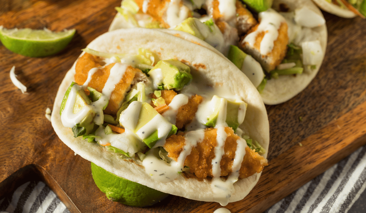 Crockpot chicken tacos served with fresh toppings and lime