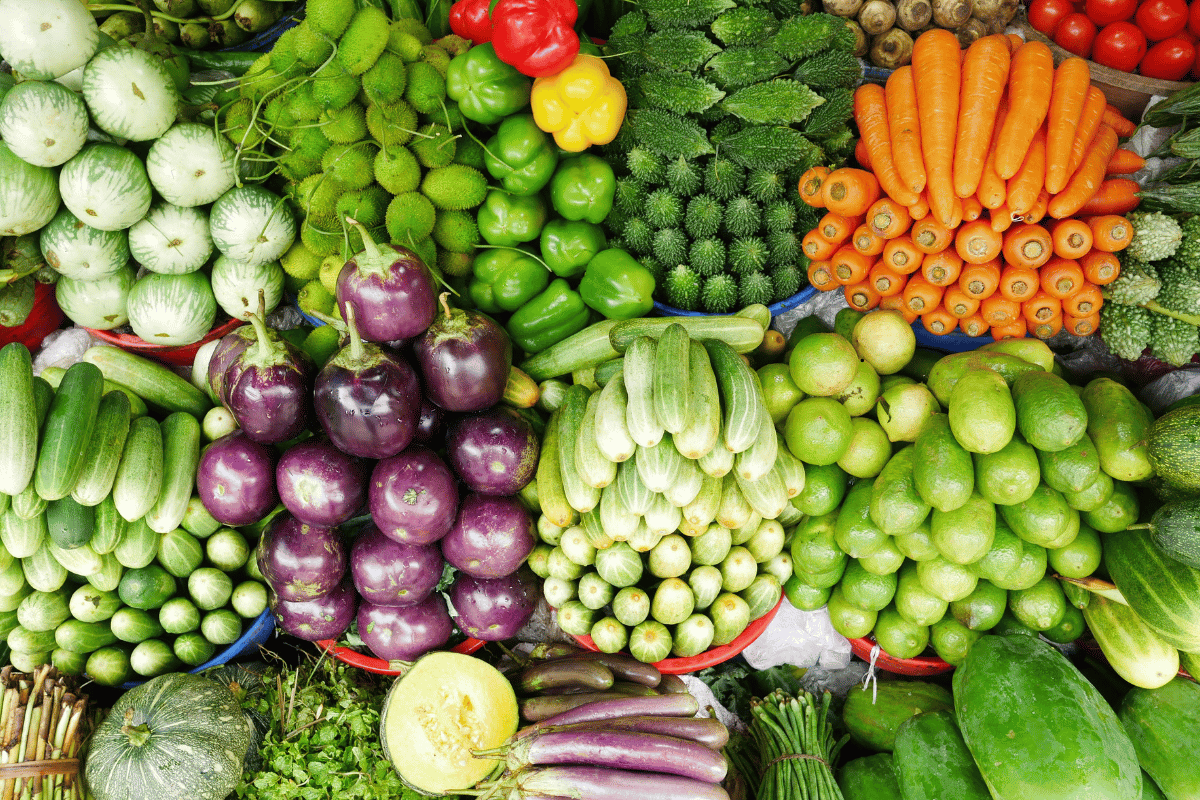 Fresh seasonal fruits and vegetables displayed at a local market.